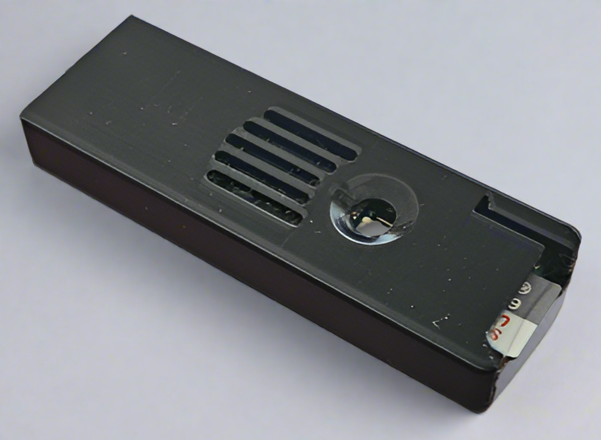 A black plastic sleeve designed to protect a Teensy board, with vent holes and a notch for easy removal of the PCB.