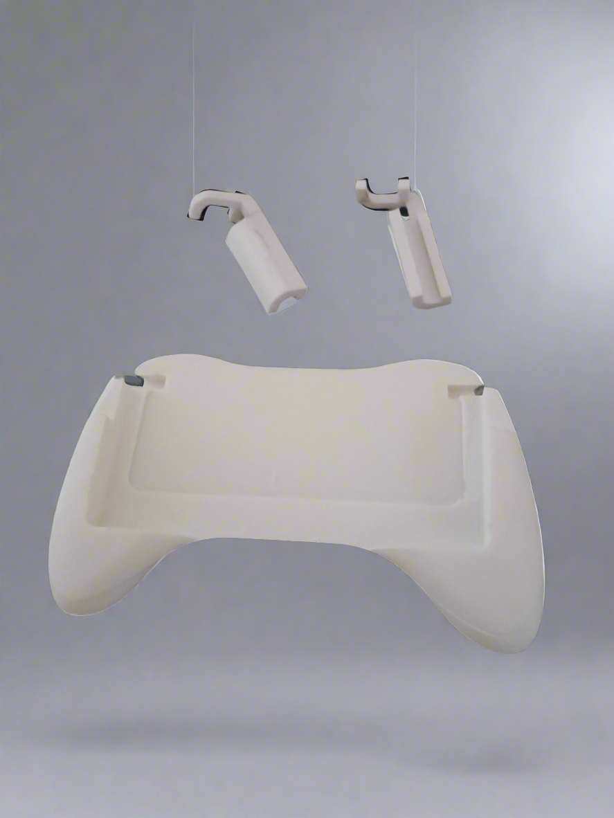 A white grip with a screen holder cutout for Nintendo DS Lite, featuring a comfortable grip surface and a clear screen holder hanging from a wire.