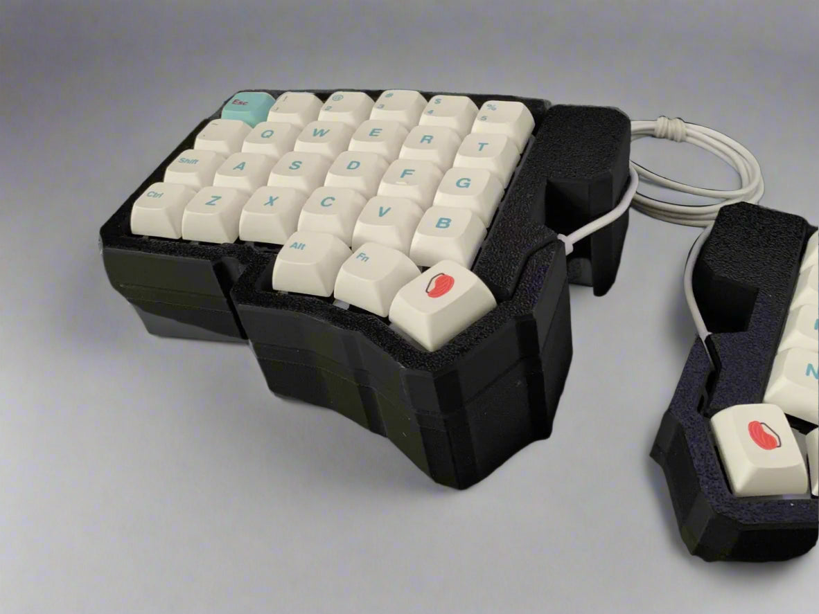 Specialized keyboard with white keys on a black background
