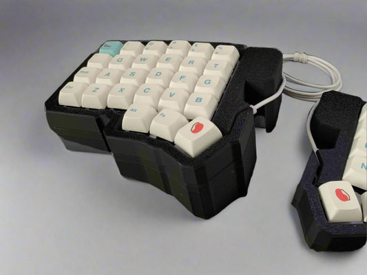 Specialized keyboard with white keys on a black background